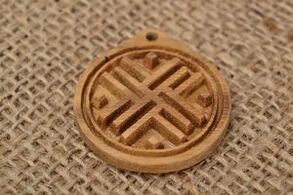 Good luck talisman made of wood and rough cloth